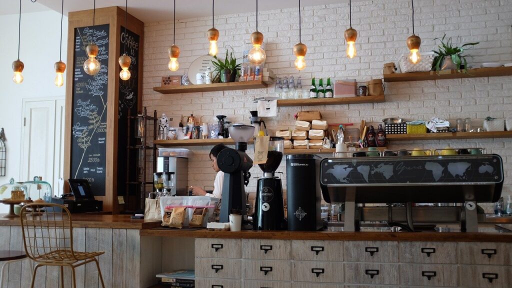 A photo of a man operating a high-end coffee shop worth 6 figures that we bought for $15k down