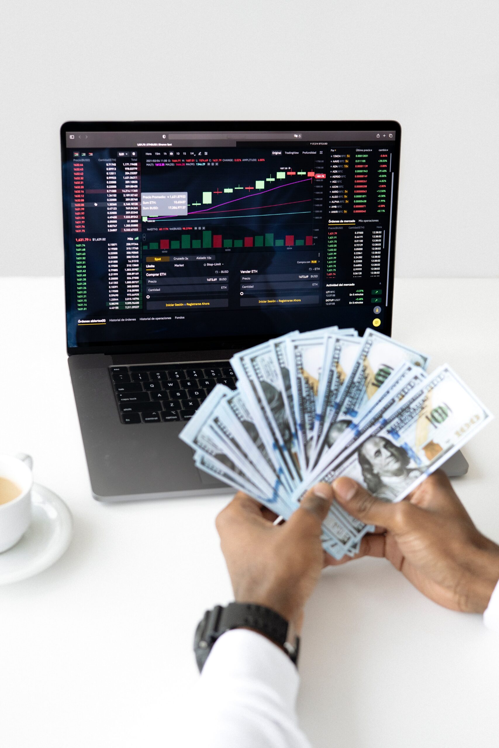 a picture of a hand handling a lot of dollar bills with a laptop on a background showing uptrend graphs that can be a result of a working private equity investment